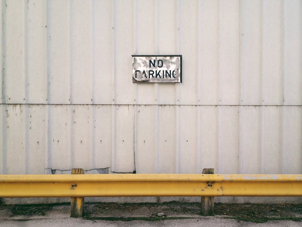 No Parking Sign on Wall